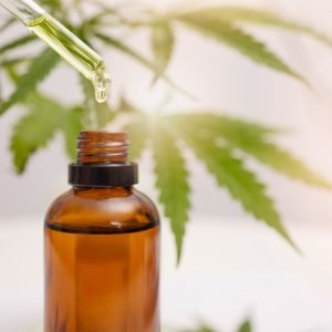 cbd oil, hemp and cannabis leaf and dropper bottle for stress, healthcare and holistic use. Marijua